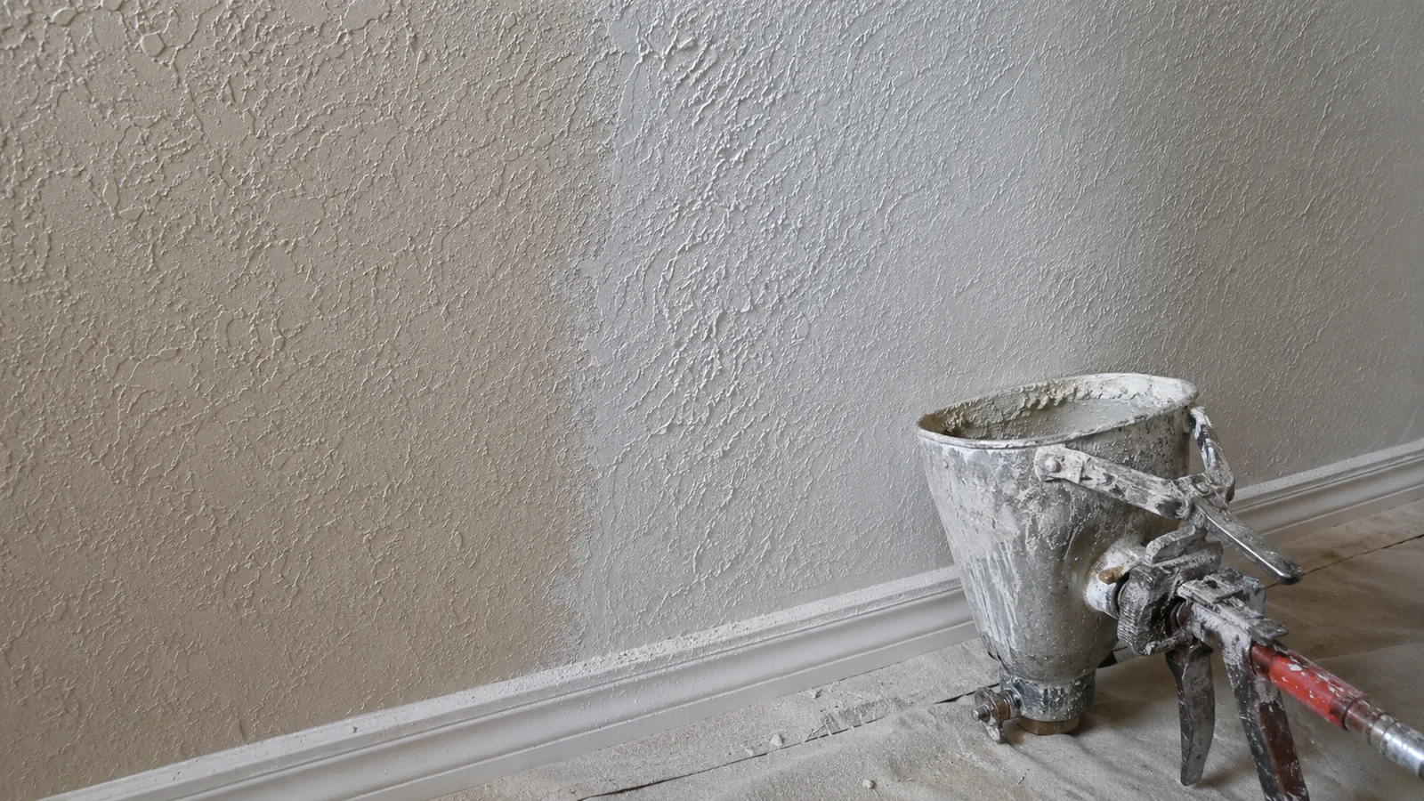 Fresh knockdown texture blended into older painted knockdown on an interior wall in Arvada, CO