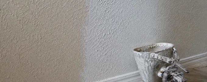 Fresh knockdown texture blended into older painted knockdown on an interior wall in Arvada, CO